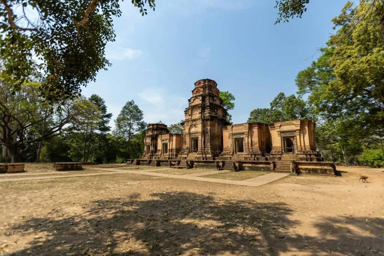 Explore the ancient ruins of a temple in Siem Reap, Cambodia under a clear blue sky.